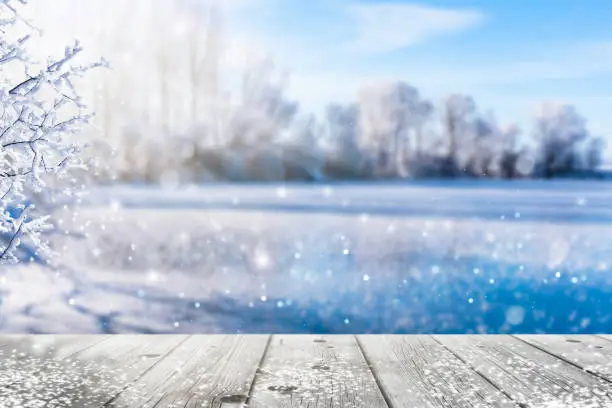 Photo of frozen lake in idyllic winter landscape
