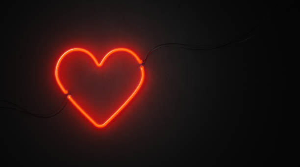 istock Heart Shaped Red Neon Light On Black Wall - Valentines Day Concept 1062646660