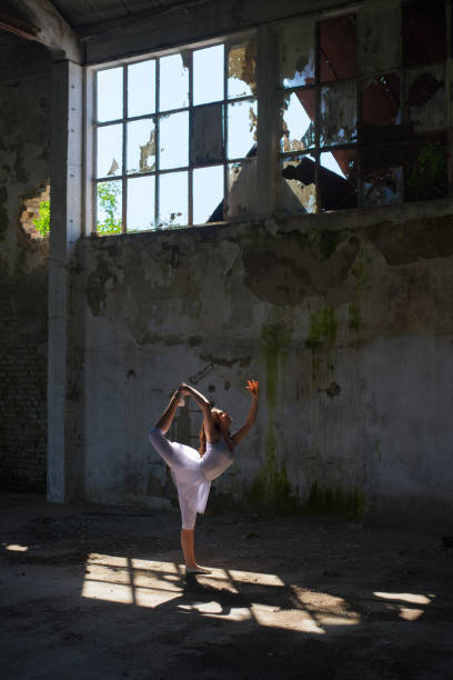 istock Ballerina dancing in an abandoned building 1062648936