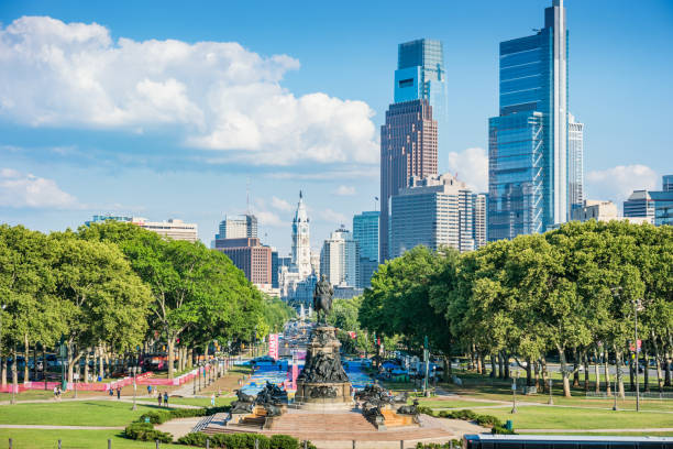 Downtown Philadelphia Pennsylvania USA Cityscape of downtown Philadelphia with the George Washington Monument, Benjamin Franklin Parkway, City Hall and the financial district on a sunny day. benjamin franklin parkway photos stock pictures, royalty-free photos & images