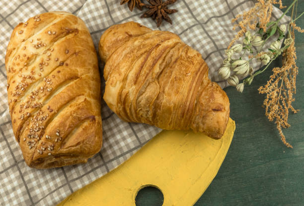 istock Breakfast Continental with many fresh croissants with chocolate and sauce. Delicious baking top view. crispy croissant. 1062666492