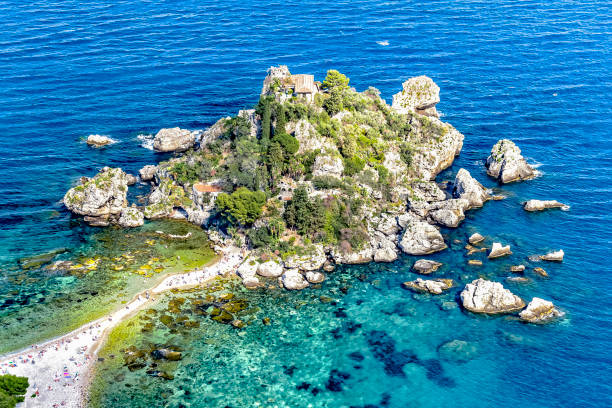 The island of Isola Bella in the mazzarò hamlet of taormina in Sicily The island of Isola Bella in the Mazzarò district of the city of Taormina in Sicily isola bella taormina stock pictures, royalty-free photos & images