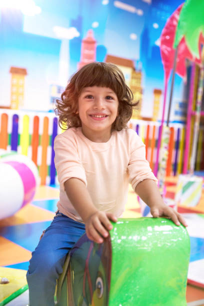 istock Happy smiley Little kid having fun on playground. 1062674828