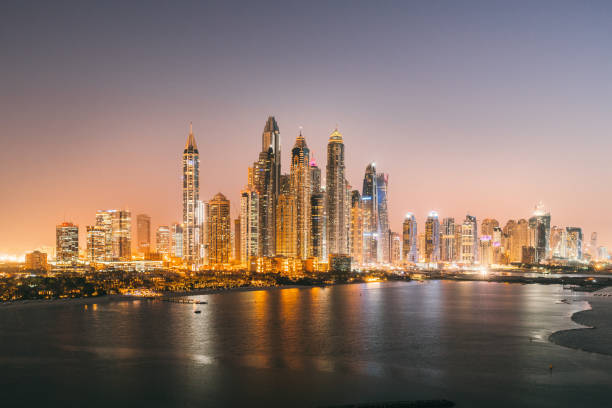 istock Dubai Marina Skyscraper at night 1062675328