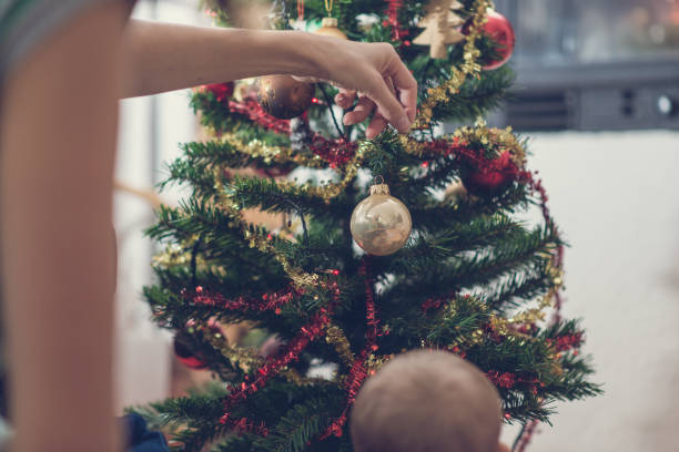 istock Retro image of a woman decorating Christmas tree 1062677502