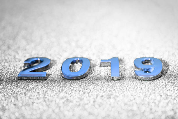 istock New Year 2019 on a sparkling defocused background (gray) 1062678748