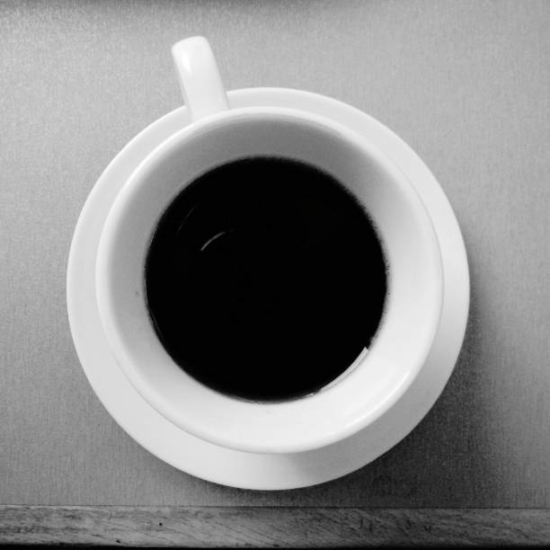 istock A cup of black coffee in a white mug on the table 1062680082