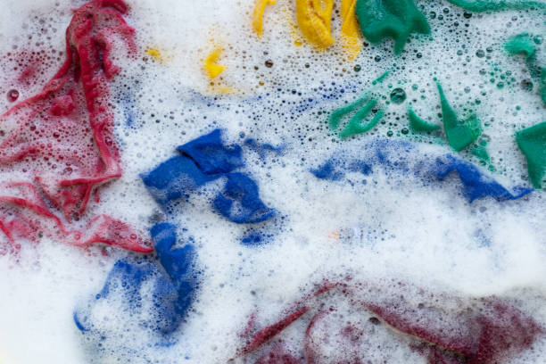 istock Washing clothes, colorful clothes soaked. 1062684384