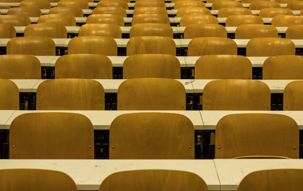 istock Simmetrical Chairs Lines in College Classroom. University, school environment 1062686192