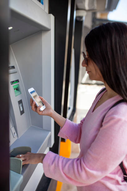 istock Cash dispenser with smartphone 1062688774