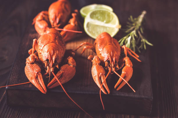 istock Boiled crayfish on the wooden board 1062693234