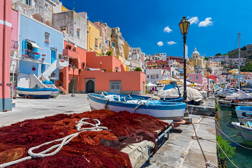 Pretty fishing village, colourful fishermen's houses, and fishing nets, Marina Corricella Procida Island, Bay of Naples, Italy.
