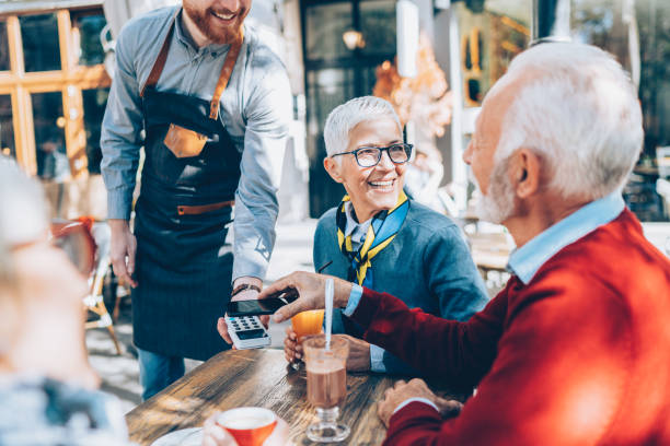 istock Senior man paying contactless with smart phone 1062693750