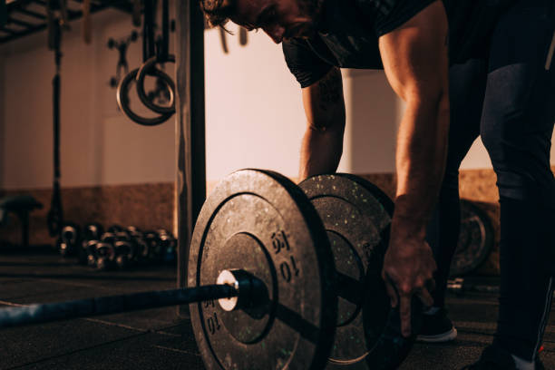 istock Muscular guy on cross training - weightlifting and squats 1062696090