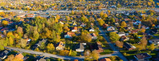 istock Panorama, flying over villa and tree area just at sunset 1062696254