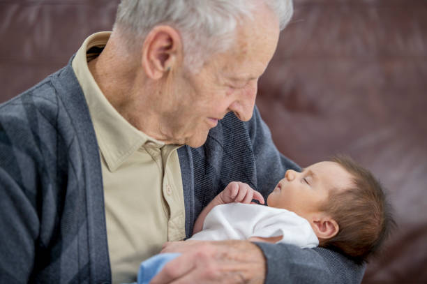 istock Sleeping Baby With Grandpa 1062696322