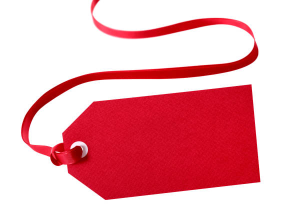 istock Gift tag red ribbon isolated on white close up 1062696766