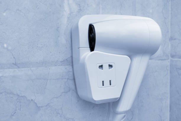 istock Hotel hand hairdryer on wall 1062702844