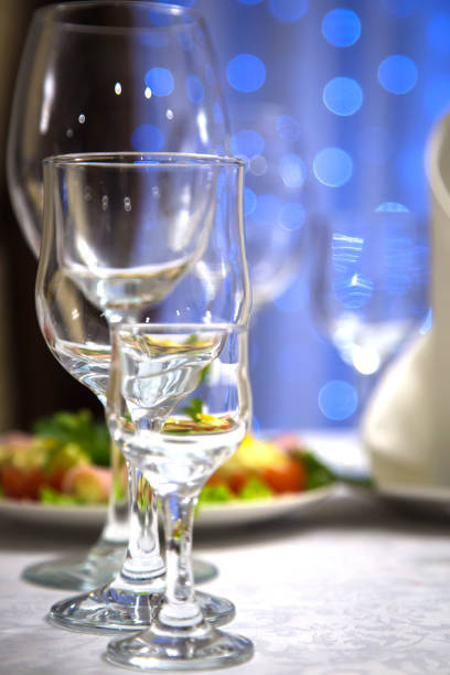 istock Empty glasses of wine and water on the holiday table 1062705628