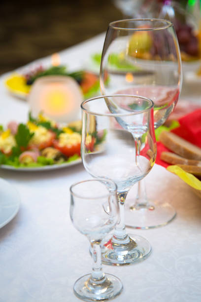 istock Empty glasses of wine and water on the holiday table. 1062705700