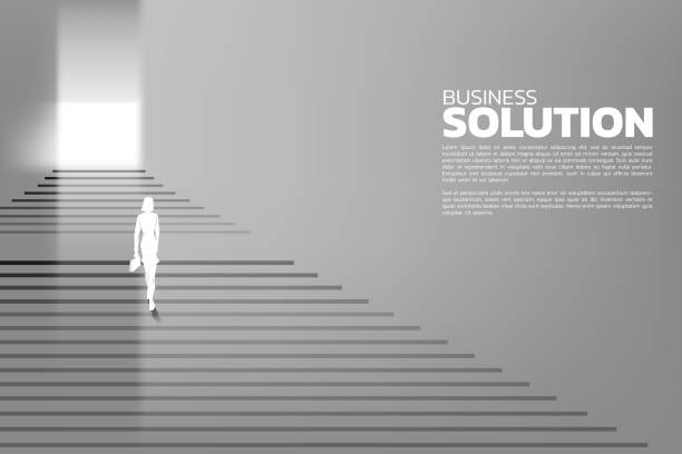 istock Silhouette of businesswomen with briefcase step up on stair to exit the door. 1062705900