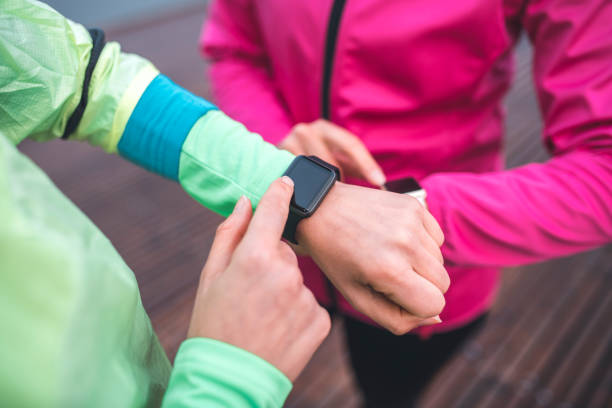 istock Young sportswomen checking pulse on smart watch 1062706222