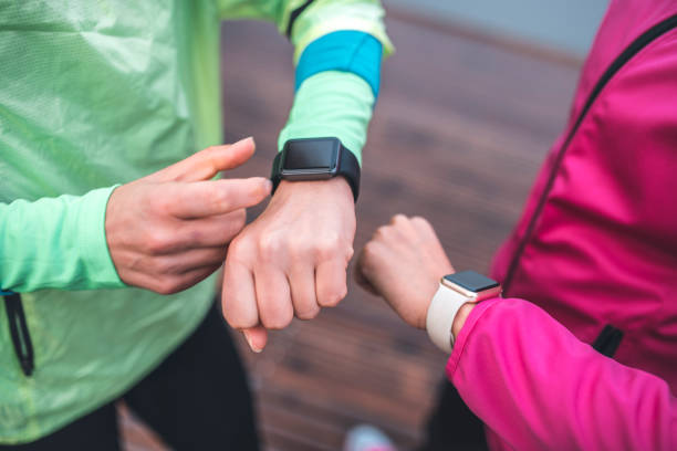 istock Young sportswomen checking pulse on smart watch 1062706276