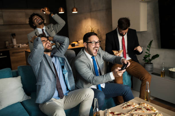 istock A group of young business man playing video games after work 1062728566