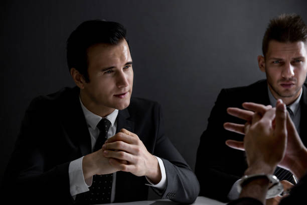 istock Detectives interview suspect or criminal man in interrogation room 1062744776