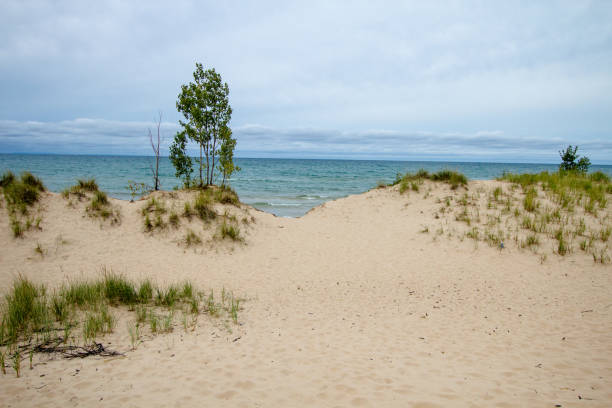 istock Massive Sand Dunes And Blue Water On Lake Michigan 1062749094