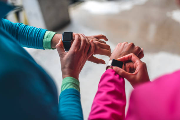 istock Young sportswomen comparing training results on smart watch 1062750864