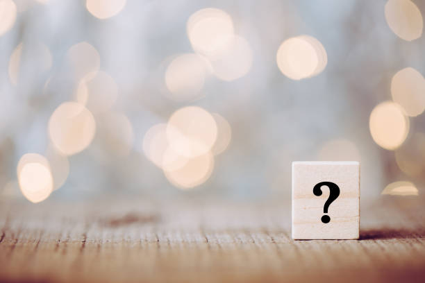 Question Mark Block Question mark block with bokeh shining background. token photos stock pictures, royalty-free photos & images