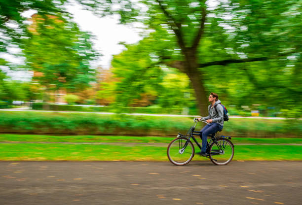 Breda, Netherlands - August 26, 2018: An unidentified cyclist cycling on streets of Breda, a city located in the province of North Brabant.