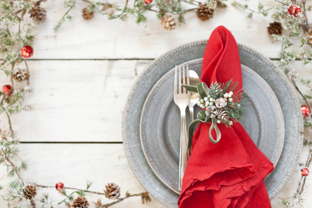 istock Christmas holiday dining place setting on old wood table 1062777160
