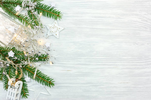 istock christmas tree branch decorated with garland lights and different stars 1062781268