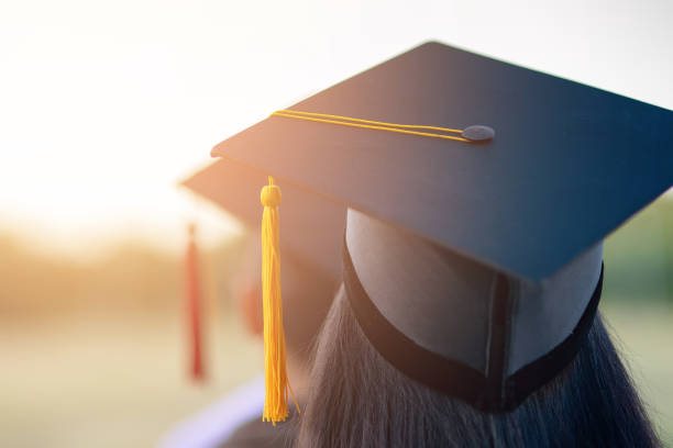 istock Back portrait of graduated wearing a black hat. 1062799126