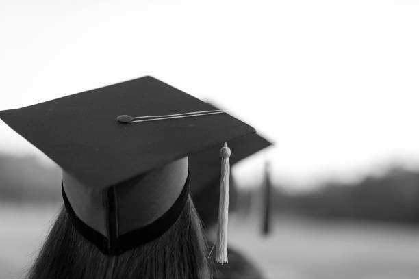 istock Back portrait of graduated wearing a black hat. 1062799148