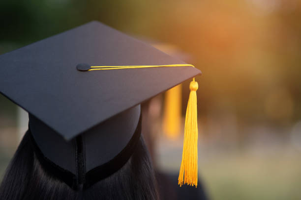 istock Back portrait of graduated wearing a black hat. 1062799164