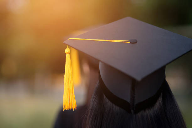 istock Back portrait of graduated wearing a black hat. 1062799170
