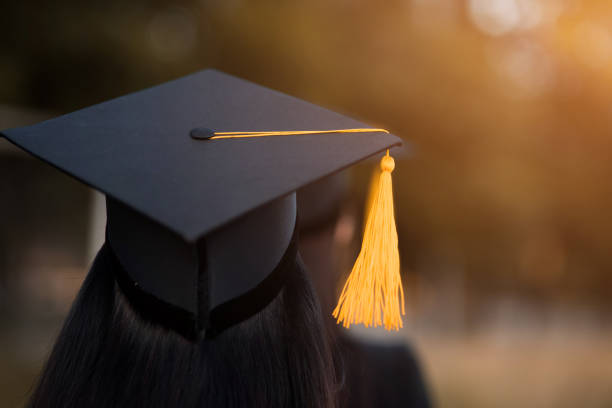 istock Back portrait of graduated wearing a black hat. 1062799172