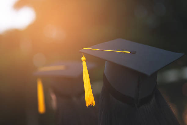 istock Back portrait of graduated wearing a black hat. 1062799196