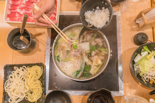 istock People eating Japanese hot pot with rice 1062802400