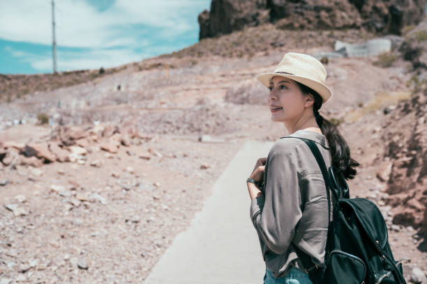 istock Cheerful traveler in straw hat visit hoover dam. 1062807500