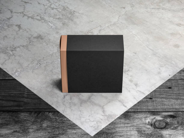 istock Gold Gift Box Mockup with black case on concrete floor 1062809422