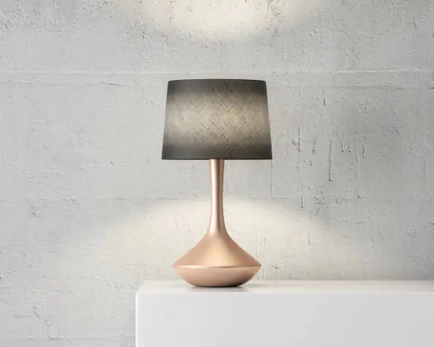 Photo of Stylish table lamp mockup with black shade and gold stand on white table