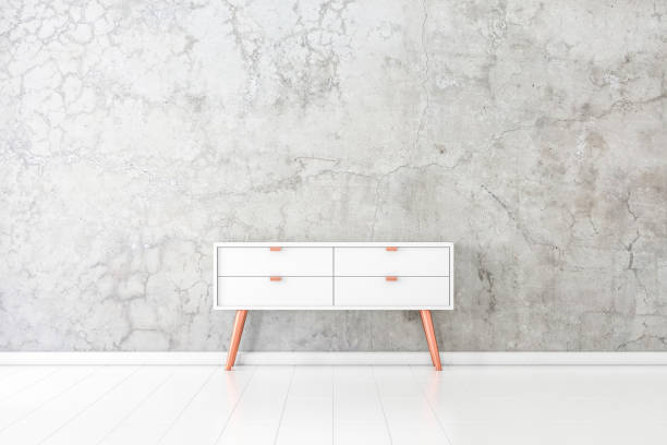 istock Modern nightstand near concrete wall mockup 1062811568