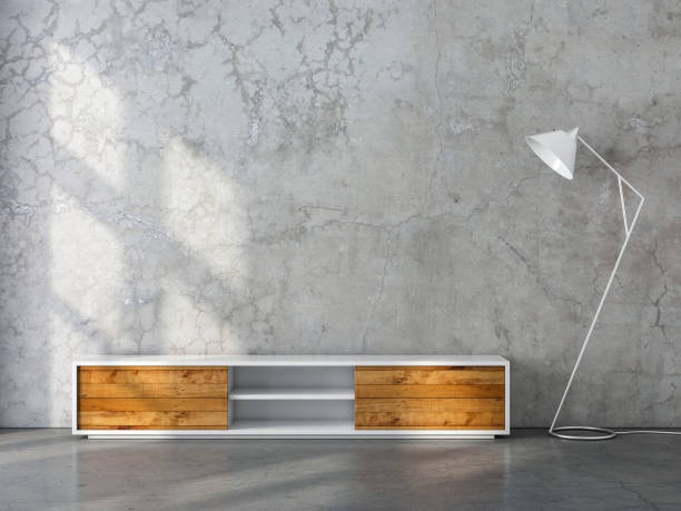istock Modern tv console mockup with wooden facade and modern floor lamp in empty room 1062811574