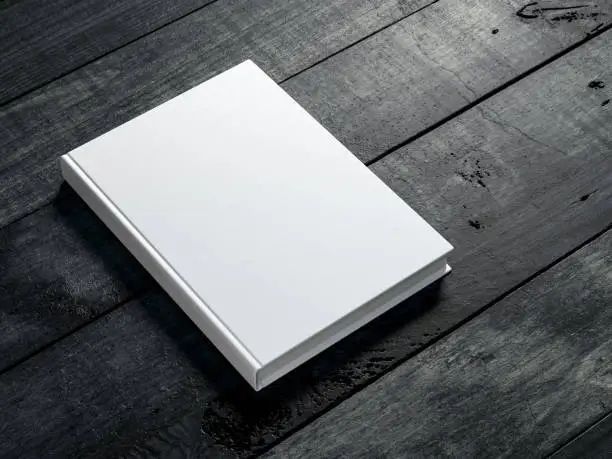 Photo of White book Mockup on dark wooden table background