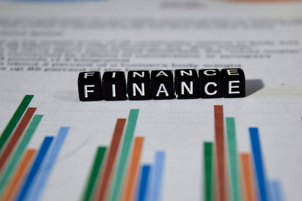 istock Finance on wooden blocks. 1062816028
