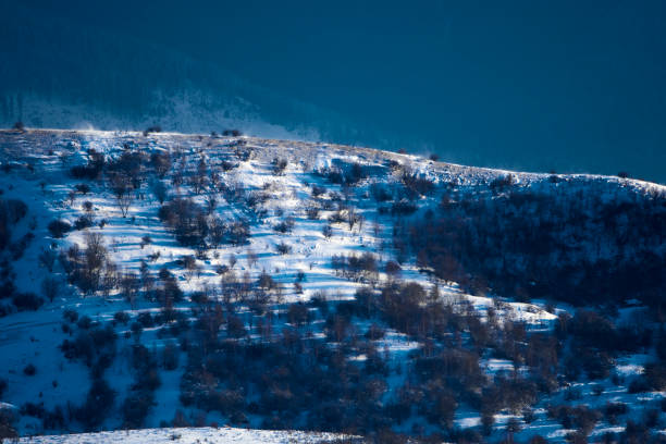 hill in windy winter night, nature background.